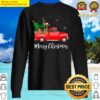 airedale terrier dog riding red truck christmas sweater