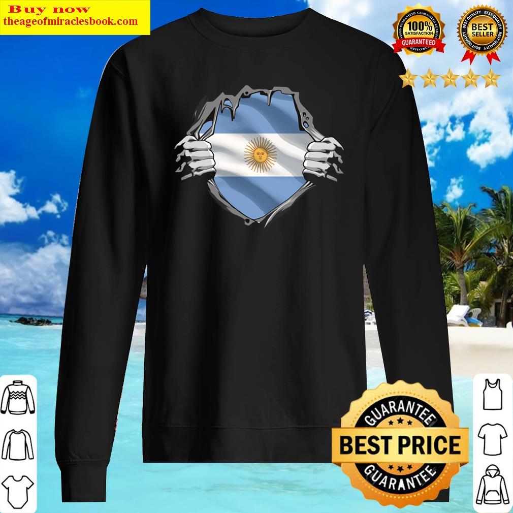 two hands ripping revealing flag of argentina sweater