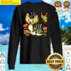 white and yellow cat with flowers sweater